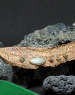 copper plated leaf pendant from Azores with moonstone and peridots
