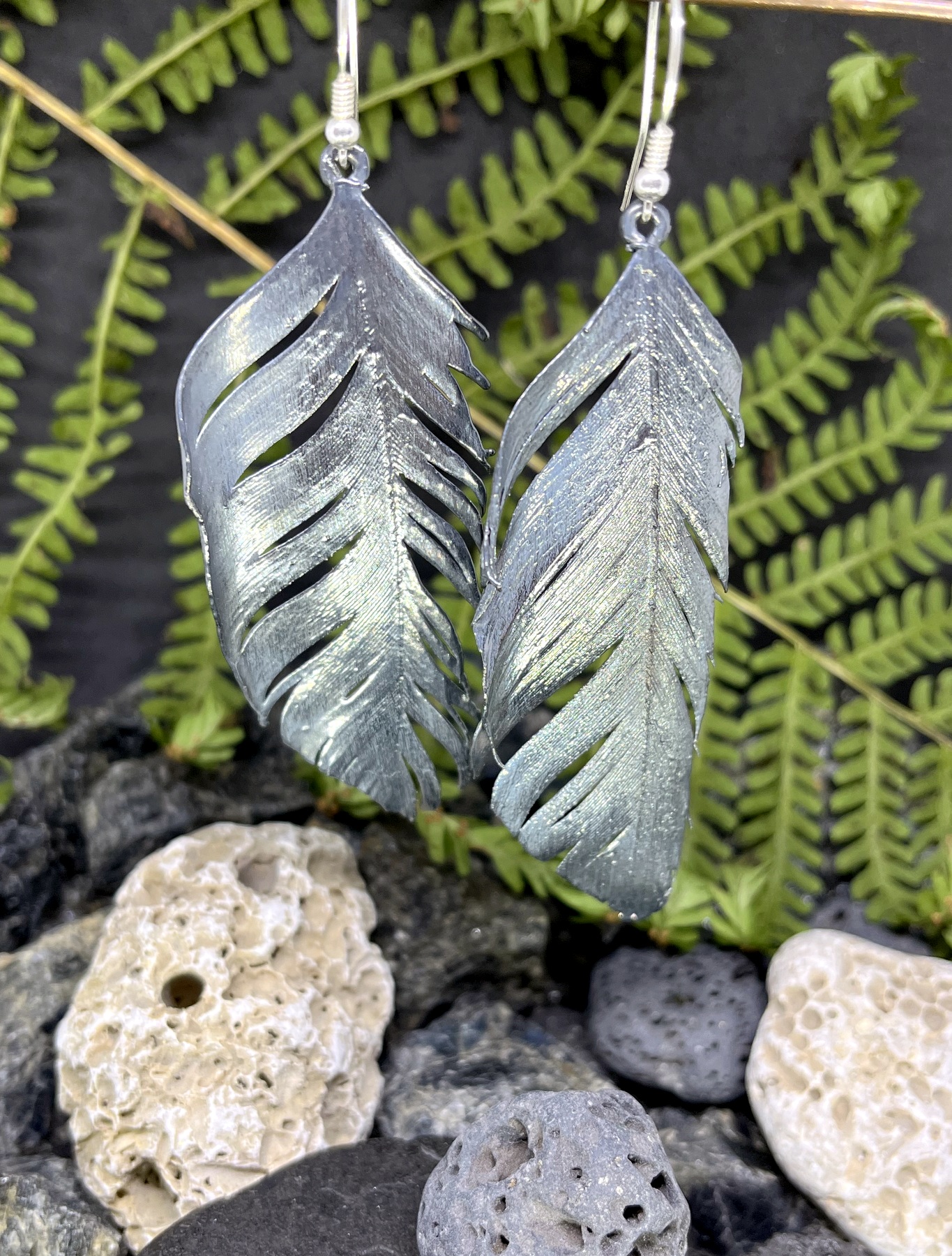 aged silver plated feather earrings