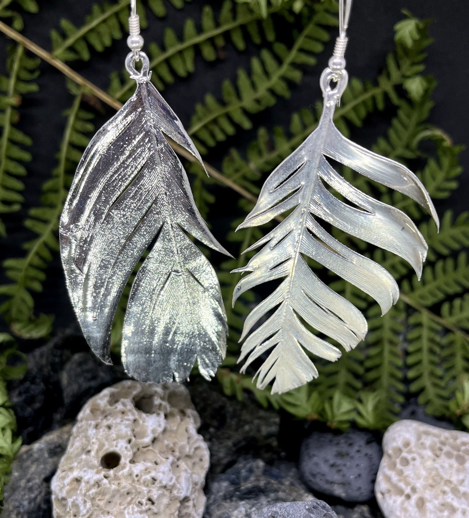 aged silver plated feather earrings